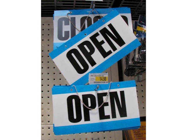 photograph of open and closed signs