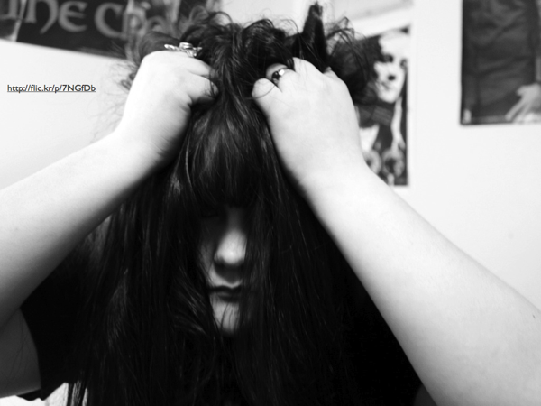 A woman grabbing her hair in frustration