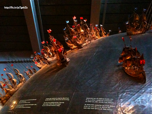 Miniature ship models on a large globe